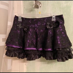Layered mini skirt with bows.